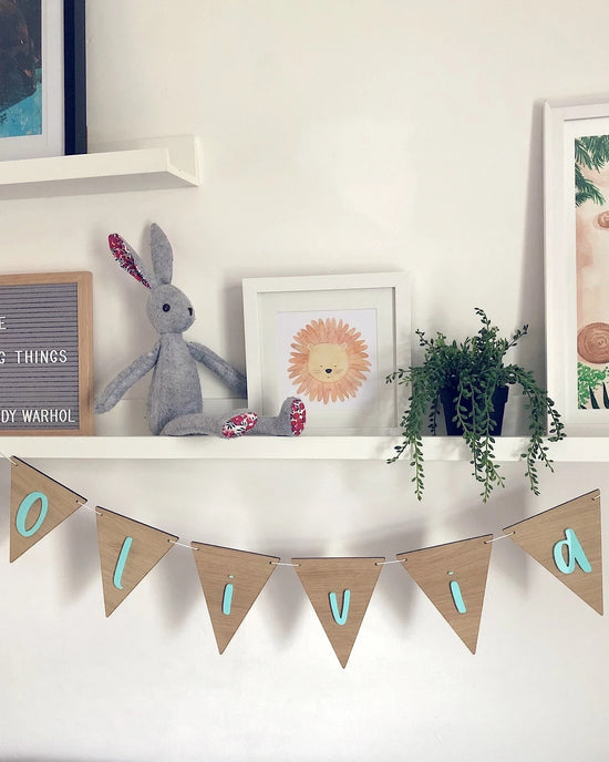Personalised wooden bunting stocked at Alf & Co Nottinghams Children’s Shop. A lovely personalised baby gift 