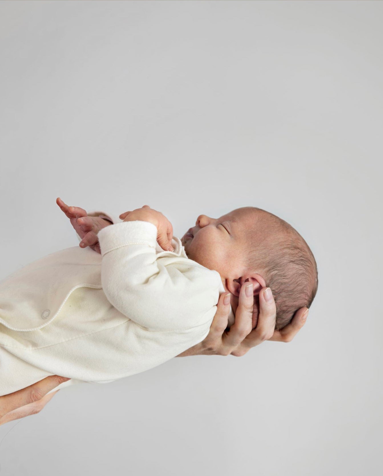 This Gray Label Baby Romper Suit in grey marl is a lovely addition to a baby gift hamper