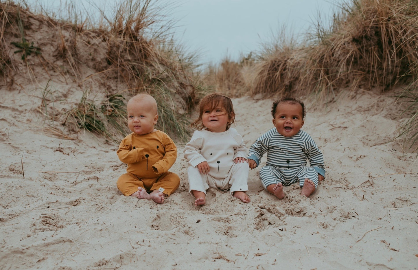 Load image into Gallery viewer, Alf &amp;amp; Co is a midlands based children’s store and they are stockist of the brand new Turtledove London Character Bear Face Baby Romper-Sunshine 
