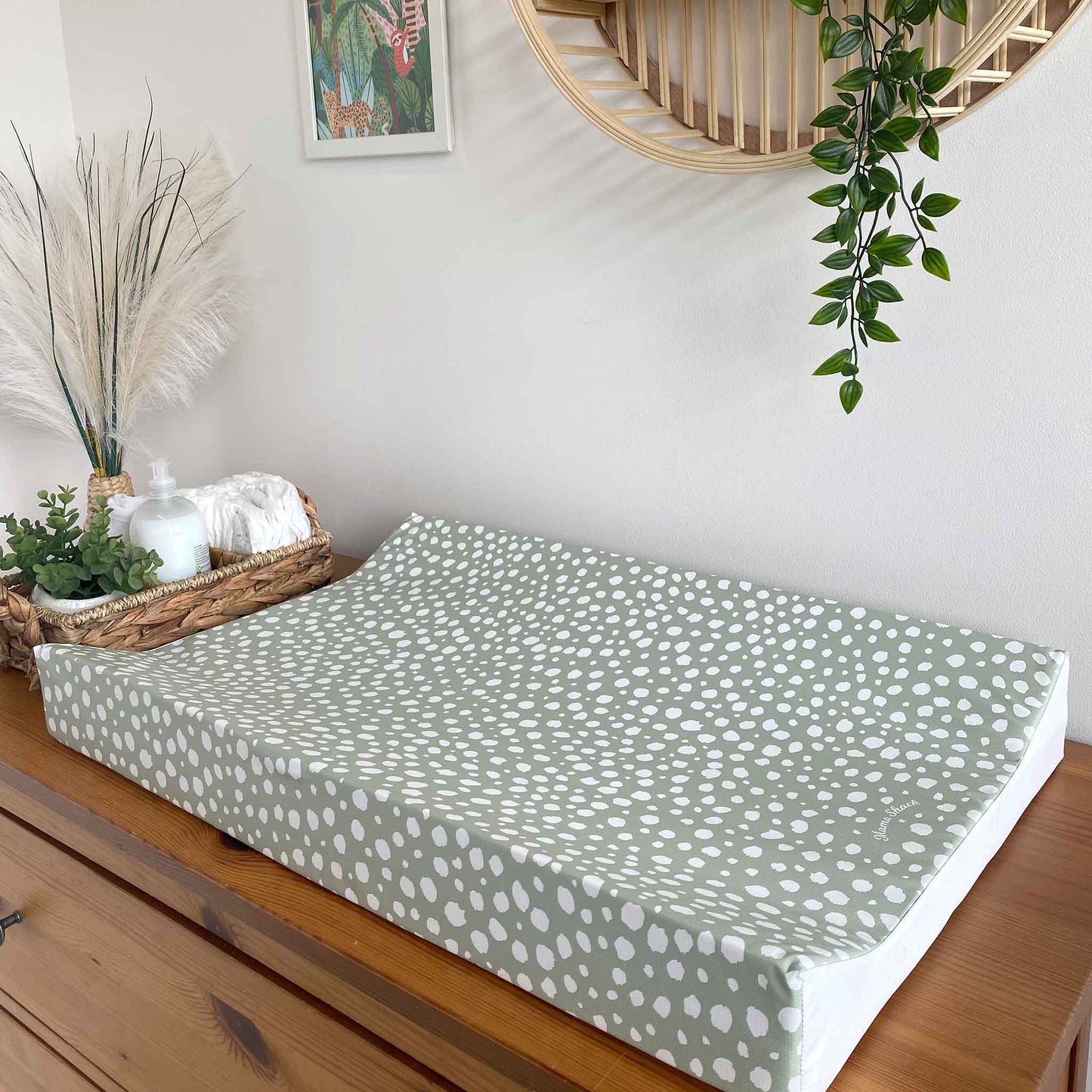 The Anti Roll Changing Mat by Mama Shack in the sage dotty print is a lovely and practical addition to any nursery 
