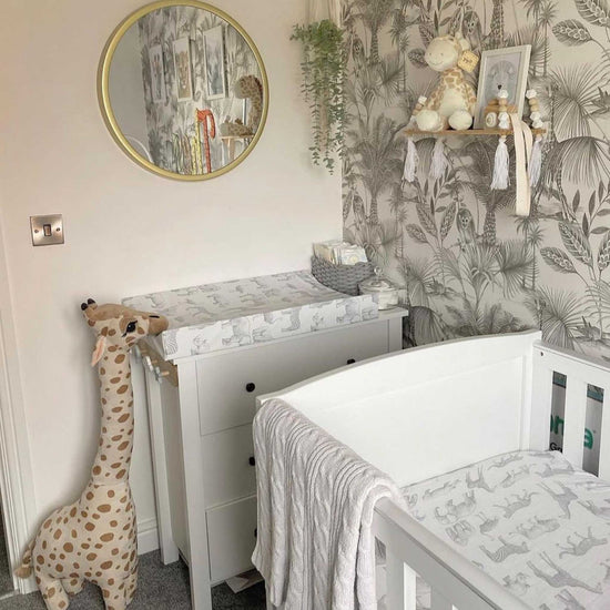 The Anti Roll Changing Mat by Mama Shack in the Monochrome Safari print is a lovely addition to any nursery 