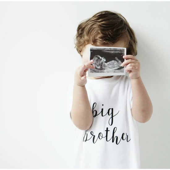 Rose and guy, sibling t-shirts, big brother tee, new baby announcement, gender reveal, gender reveal clothing, siblings, sibling t-shirts, nottingham baby shop, midlands baby shop, new baby clothing, baby shower gift, rose and guy stockist, milestone tees, new baby boy gifts 