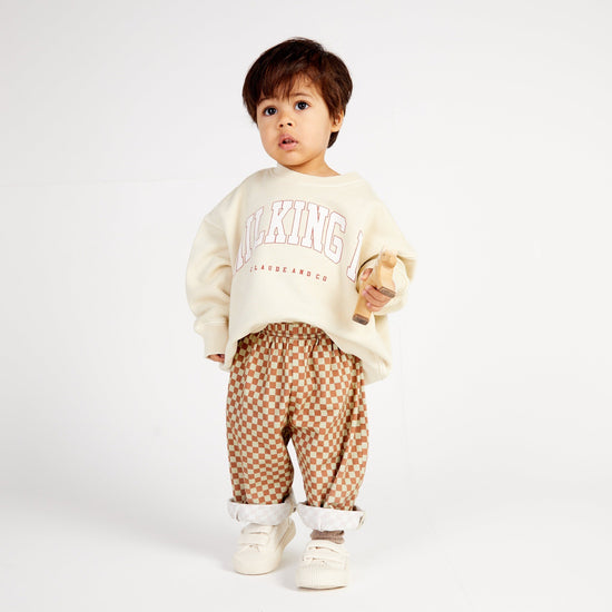 Load image into Gallery viewer, The brand new Claude and Co Milking It College Sweater-Kids Oat is available from Nottinghamshire Children’s Store Alf &amp;amp; Co
