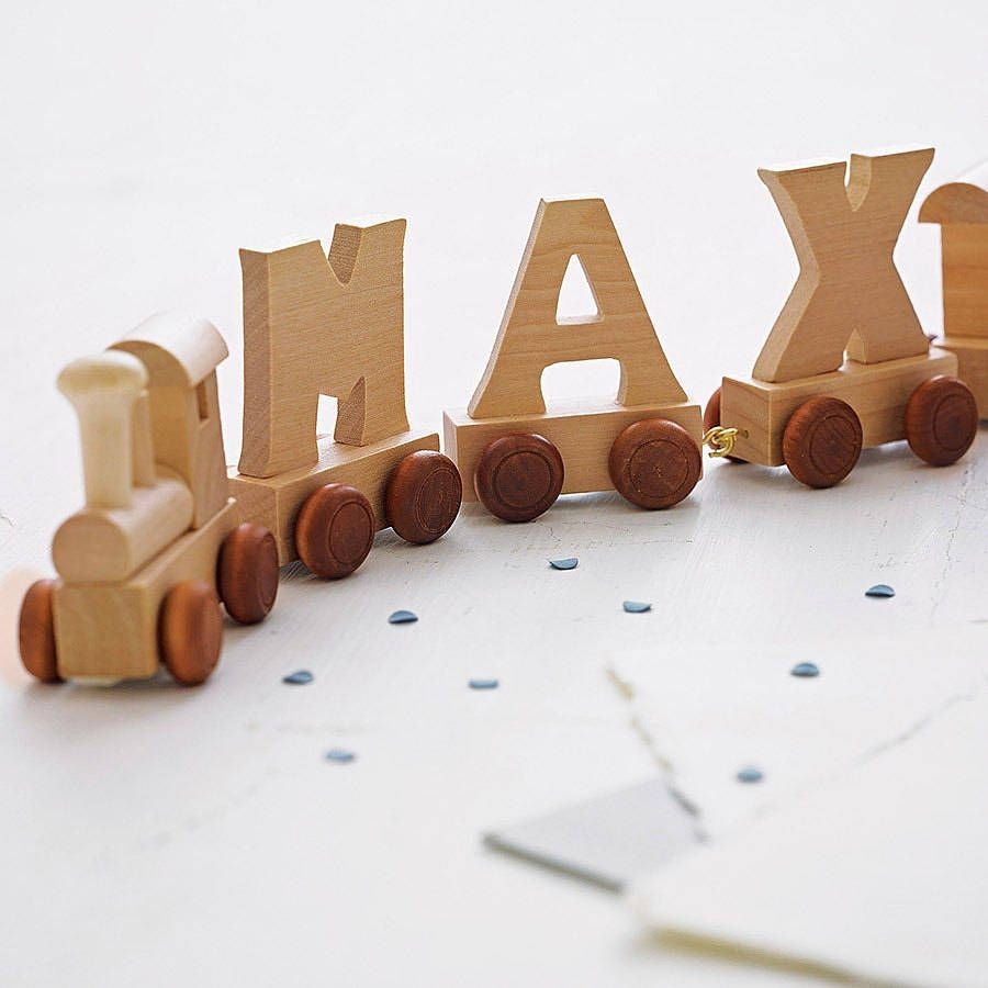 Personalised Wooden Letter Name Train and Accessories gifting set makes the perfect christening, baby shower or new arrival gift.