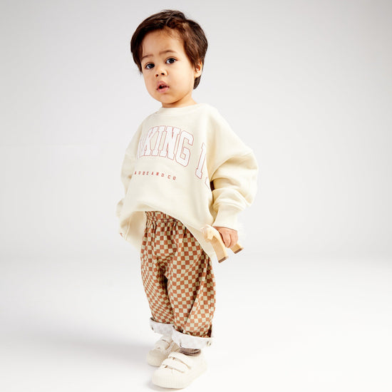 The Claude and Co Milking It College Oat Sweater is perfect for little ones who want to twin with their grown up!