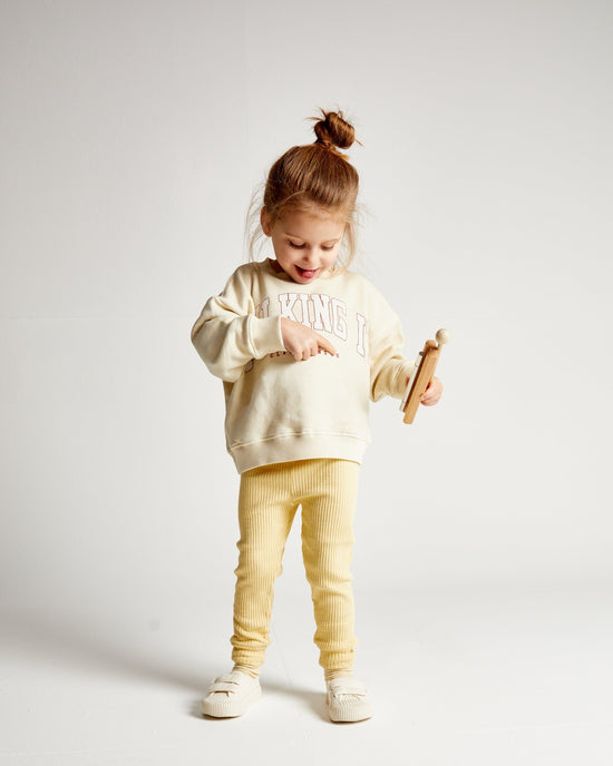 Load image into Gallery viewer, Alf &amp;amp; Co is a midlands based children’s Store and they are stockist of the Claude and Co Milking It College Sweater-Kids Oat 
